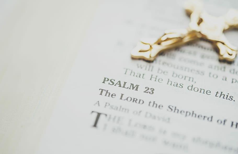 A crucifix resting on an open Bible.